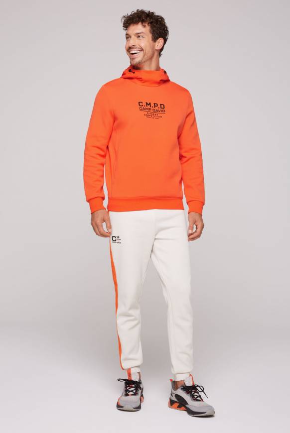 Soccx Hoodie im Materialmix mit Artwork und Rückentasche signal orange Vatertagsangebot